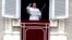 FILE - Pope Francis waves to the crowd as he arrives for the Angelus noon prayer from the window of his studio overlooking St. Peter's Square, at the Vatican, Feb. 25, 2018. 