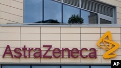 A general view of AstraZeneca offices and the corporate logo in Cambridge, England, Saturday, July 18, 2020. 