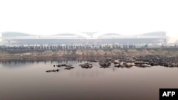 FILE - Haze covers the airport in Palangkaraya, central Kalimantan, Indonesia, Sept. 16, 2019. An American journalist was detained in Palangkaraya in December, and later formally arrested, for alleged visa violations.