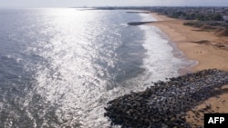 This aerial view shows a groyne (shore protection structure), on a beach east of Cotonou on October 23, 2023.