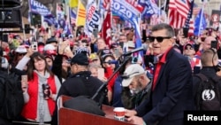 Former U.S. national security adviser Michael Flynn speaks as supporters of U.S. President Donald Trump listen during a rally to protest the results of the election in front of Supreme Court building, in Washington, U.S., Dec. 12, 2020.