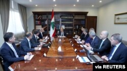 Lebanon's President Michel Aoun heads a financial meeting with Prime Minister Hassan Diab, Parliament Speaker Nabih Berri and Lebanon's Central Bank Governor Riad Salameh at the presidential palace in Baabda, March 7, 2020.