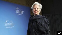 France's Finance Minister Christine Lagarde, who serves as chair of the Group of 20, begins a news conference at the International Monetary Fund and World Bank meetings in Washington, April 15, 2011