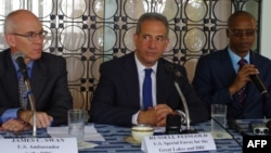 FILE - U.S. Special Envoy for the Great Lakes and the Democratic Republic of the Congo, Russel Feingold, center, talks to reporters in Kinshasa on the last leg of a 10-day visit to the country on January 28, 2014. 