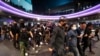 Pro-democracy protesters march to a local police station demanding the release of pro-democracy activists in Bangkok, Thailand, Feb. 10, 2021. 