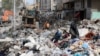 An excavator clears the rubble of a destroyed building in Gaza City's Rimal residential district on May 16, 2021, following massive Israeli bombardment on the Hamas-controlled enclave.