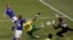 Japan's Keisuke Honda, top left, scores the opening goal against Cameroon goalkeeper Souleymanou Hamidou, right, and Cameroon's Stephane Mbia, third from left, during the World Cup group E soccer match between Japan and Cameroon at Free State Stadium in B