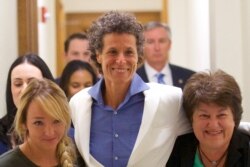 Bill Cosby accuser Andrea Constand, center, reacts after the guilty on all counts verdict was delivered in the sexual assault retrial at the Montgomery County Courthouse in Norristown, Pennsylvania, April 26, 2018.