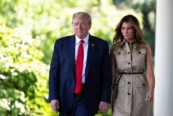 President Donald Trump and first lady Melania Trump arrive for a White House National Day of Prayer Service in the Rose Garden of the White House, May 7, 2020, in Washington.