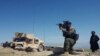 A member of Afghanistan's special forces points his gun as he observes the enemy lines in Achin district of Nangarhar province, in eastern Afghanistan April 14, 2017.