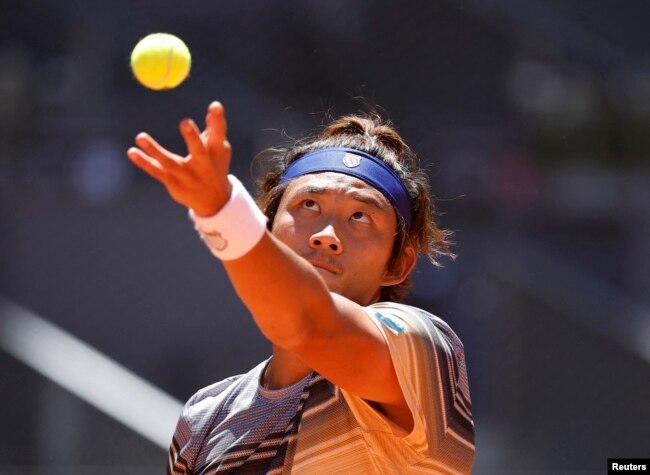 FILE - China's Zhang Zhizhen in action during his quarter final match against Russia's Aslan Karatsev at the Madrid Open at Park Manzanares, Madrid, Spain on May 4, 2023.