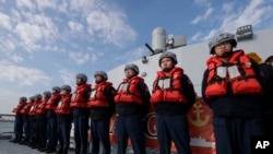 FILE - Deck crew of Taiwanese navy stand by on a Taiwan's domestically made Tuo Chiang patrol ship during a simulated attack drill off Kaohsiung City, southern Taiwan, Jan. 9, 2025.