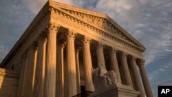 FILE - The Supreme Court in Washington, at sunset, Oct. 10, 2017. The Supreme Court is making new legal filings available online starting Monday, years behind the rest of the federal court system.