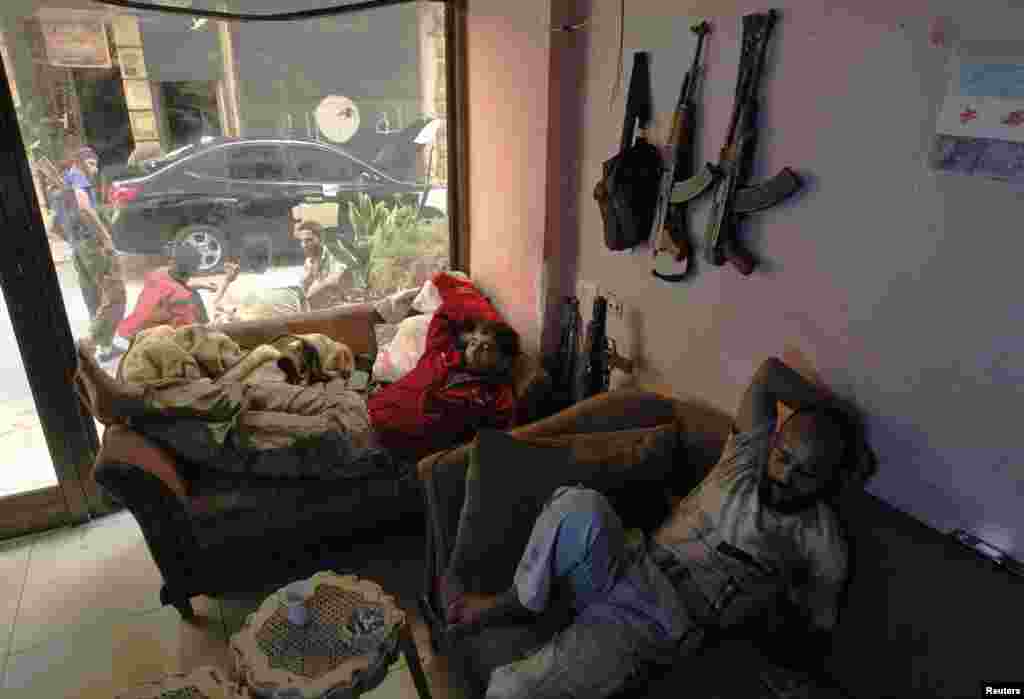 Free Syrian Army fighters rest in Sheikh Maksoud, Aleppo Oct. 1, 2013.