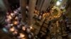 Christian clergymen hold candles during the Easter Sunday procession at the Church of the Holy Sepulcher, traditionally believed by many to be the site of the crucifixion and burial of Jesus Christ, in Jerusalem's Old City, April 20, 2014.