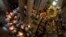 Christian clergymen hold candles during the Easter Sunday procession at the Church of the Holy Sepulcher, traditionally believed by many to be the site of the crucifixion and burial of Jesus Christ, in Jerusalem's Old City, April 20, 2014.