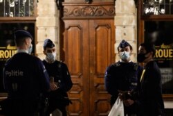 Police officers patrol in central Brussels during a curfew imposed by the Belgian government as the spread of the coronavirus disease ( COVID-19) continues, in Brussels, Belgium, Oct. 30, 2020.