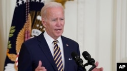 FILE President Joe Biden in the East Room of the White House, Aug. 10, 2022, in Washington.