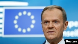 FILE - European Council President Donald Tusk addresses a news conference during a European Union leaders summit in Brussels, Belgium, Dec. 15, 2017.