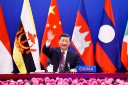 FILE - In this photo released by Xinhua News Agency, Chinese President Xi Jinping waves as he chairs the ASEAN-China Special Summit to commemorate the 30th Anniversary of ASEAN-China Dialogue Relations via video link from Beijing, China on Monday, Nov. 22, 2021. (Reuters)