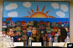 First lady Melania Trump, joined by Alexia Jo Rodriguez, Southwest Key vice president, right, and Geraldo Gabriel Rivera, Southwest Key associate vice president, left, participates in a roundtable discussion at Southwest Key Campbell, a shelter for children that have been separated form their parents stay in Phoenix, June 28, 2018.