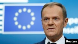 FILE - European Council President Donald Tusk addresses a news conference during a European Union leaders summit in Brussels, Belgium, Dec. 15, 2017.
