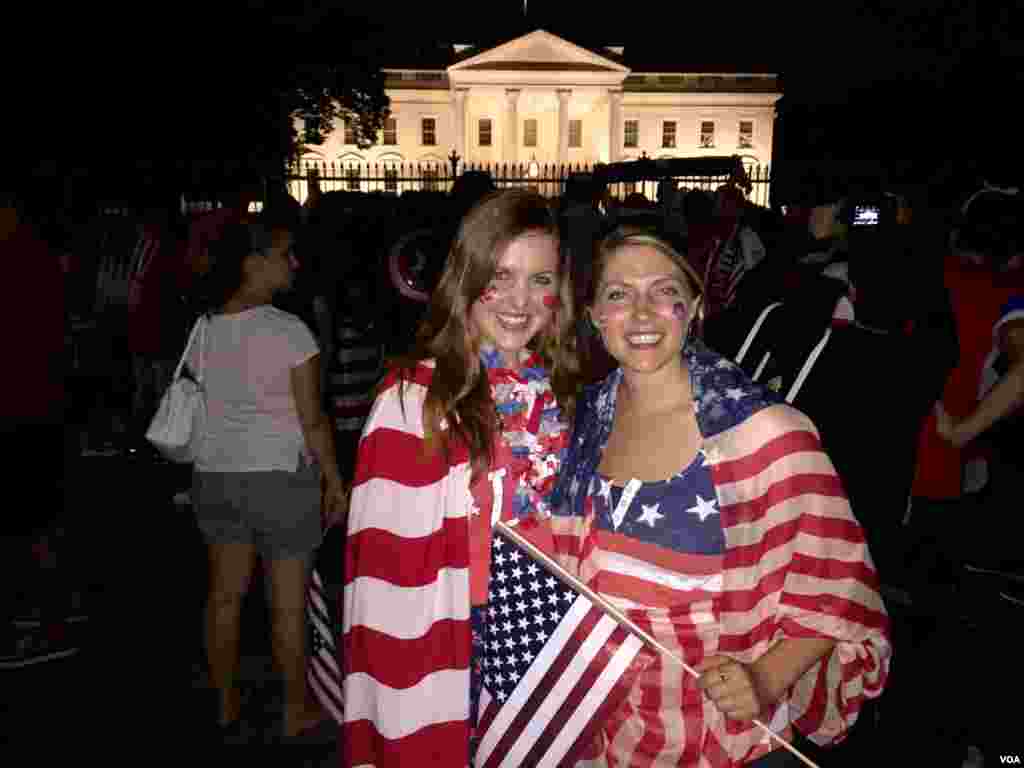 American soccer fans Laura Neff of California (left) and Kayli Westling of Wyoming (right) celebrate the U.S. women&rsquo;s national team World Cup final victory with the American Outlaws outside the White House, July 5.