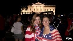 American soccer fans Laura Neff of California (left) and Kayli Westling of Wyoming (right) celebrate the U.S. women’s national team World Cup final victory with the American Outlaws outside the White House, Sunday, July 5.