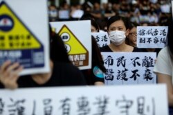 Members of Hong Kong's medical sector attend a rally to support the anti-extradition bill protest in Hong Kong, Aug. 2, 2019.