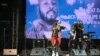 FILE - Nigerian singer Davido performs during the tribute ceremony for Ange Didier Houon, known as DJ Arafat, at the Felix Houphouet-Boigny stadium in Abidjan, Ivory Coast, Aug. 30, 2019. 