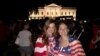 American soccer fans Laura Neff of California (left) and Kayli Westling of Wyoming (right) celebrate the U.S. women’s national team World Cup final victory with the American Outlaws outside the White House, Sunday, July 5.