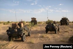 FILE - French soldiers from Operation Barkhane patrol north of Timbuktu, Nov. 6, 2014.