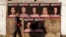 Affiches contre la violence faite aux femmes lors de la campagne d’art de rue "Just Because I am a Woman" par l’artiste Alexsandro Palombo, Milan, Italie, 16 janvier 2020. (AP Photo/Antonio Calanni)