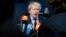 British Foreign Secretary Boris Johnson speaks with the media as he arrives for a meeting of EU foreign ministers at the Europa building in Brussels, March 19, 2018. 
