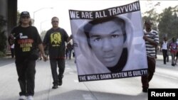 Demonstrators block traffic on a highway in Los Angeles.