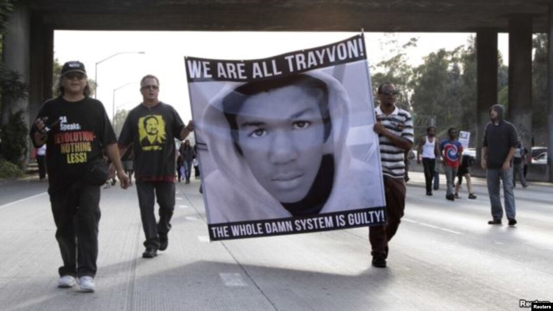 FILE - Demonstrators block traffic on a highway in Los Angeles as they protest the acquittal of George Zimmerman in the Trayvon Martin trial.