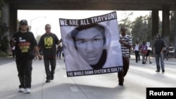 Demonstrators in Los Angeles protest the not guilty verdict.