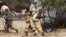 Somali government soldiers open fire during ambush by al-Shabaab rebels on the outskirts of Elasha town, May 29, 2012.