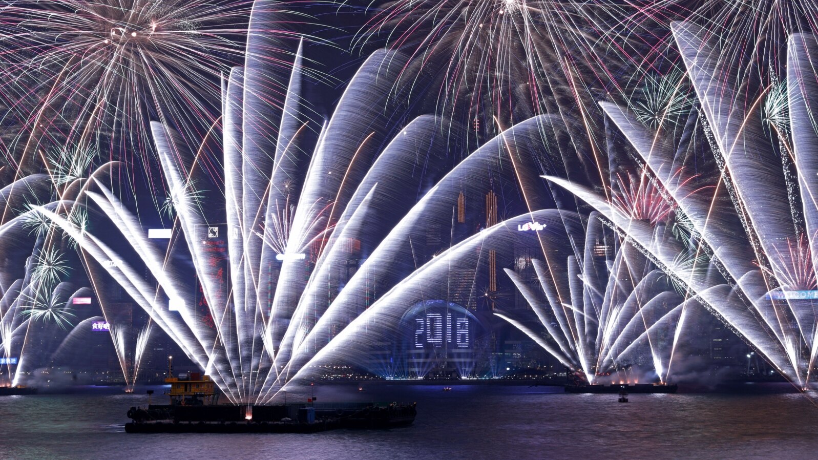 Fireworks light up the Sydney Harbour Bridge and Sydney Opera House during new year celebrations on Sydney Harbour, Australia, Jan. 1, 2018. 