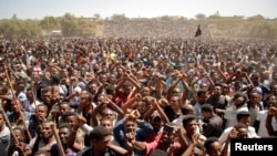 FILE - Supporters of Bekele Gerba, secretary general of the Oromo Federalist Congress, celebrate Gerba's release from prison, in Adama, Oromia Region, Ethiopia, Feb. 14, 2018. 