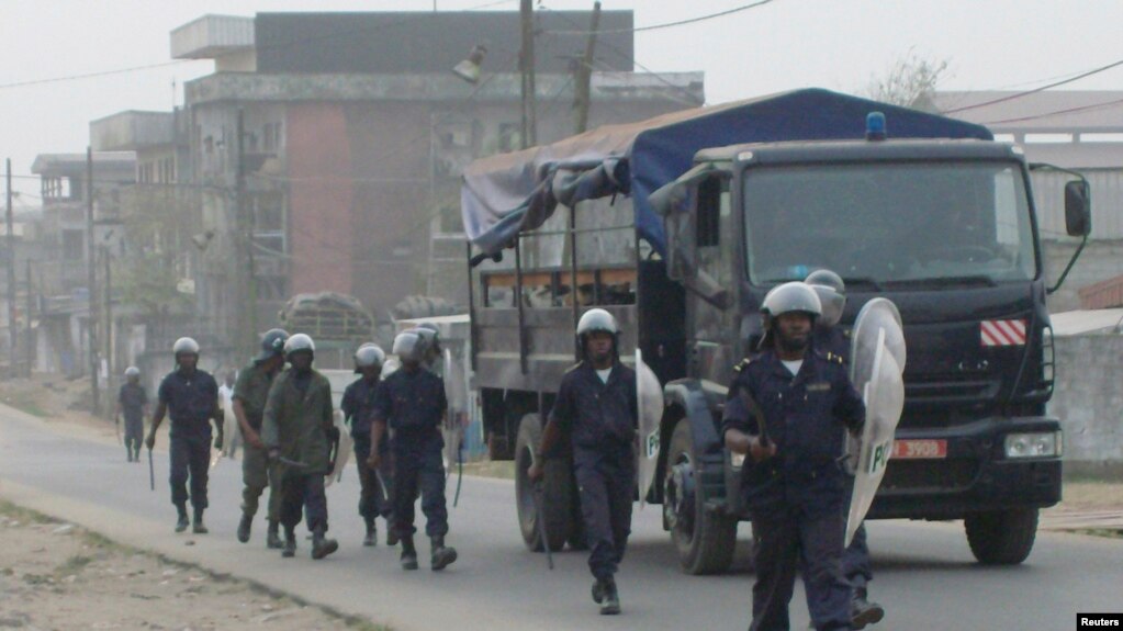 FILE - Cameroonian riot police patrol a street in the port city of Douala, Feb. 25, 2008. Incidents of street justice are growing in Cameroon.