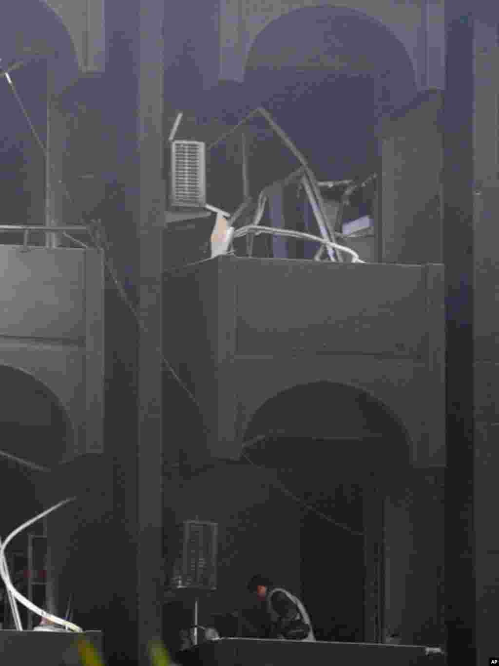 Damage after one of the many bomb attacks across Baghdad on December 22, 2011, claimed by the al-Qaida linked Islamic State of Iraq. (AP)