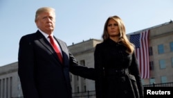 U.S. President Donald Trump and first lady Melania Trump attend the 9/11 observance at the National 9/11 Pentagon Memorial in Arlington, Virginia, Sept.11, 2017. 