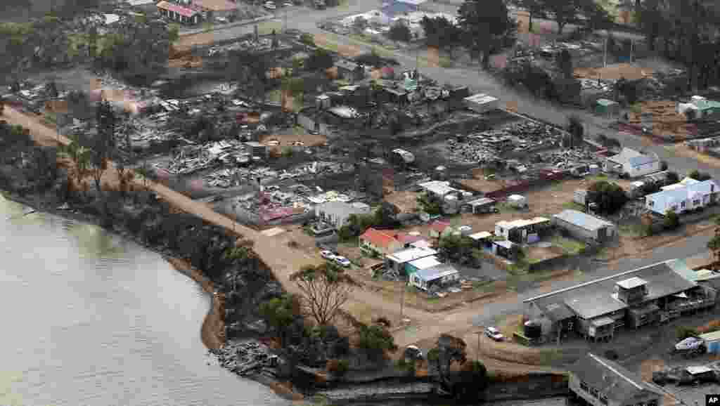 An aerial photo shows a view of Dunalley after a wildfire destroyed around 80 buildings in and around the small town, east of the Tasmanian capital of Hobart, Australia, January 5, 2013.