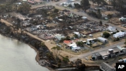 An aerial photo shows a view of Dunalley after a wildfire destroyed around 80 buildings in and around the small town, east of the Tasmanian capital of Hobart, Australia, January 5, 2013.