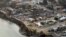 An aerial photo shows a view of Dunalley after a wildfire destroyed around 80 buildings in and around the small town, east of the Tasmanian capital of Hobart, Australia, January 5, 2013.