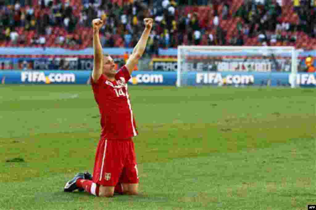 Serbia's Milan Jovanovic celebrates his side's 1-0 win at the end of the World Cup group D soccer match between Germany and Serbia at Nelson Mandela Bay Stadium in Port Elizabeth, South Africa, Friday, June 18, 2010. (AP Photo/Darko Vojinovic)