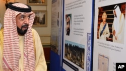 FILE - President of the United Arab Emirates, Sheikh Khalifa bin Zayed Al Nahyan looks at a photographic exhibition during his visit to Clarence House in central London on the second day of his State Visit to the UK, May 1, 2013.