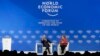 Klaus Schwab, founder and Executive Chairman of the World Economic Forum, talks with German Chancellor Angela Merkel after she addressed the annual meeting of the World Economic Forum in Davos, Switzerland, Jan. 23, 2019. 