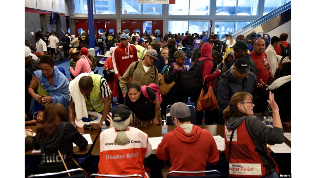 Volunteers with The American Red Cross register evacuees at the George R. Brown Convention Center after Hurricane Harvey inundated the Texas Gulf coast with rain causing widespread flooding, in Houston, Texas, Aug 28, 2017.